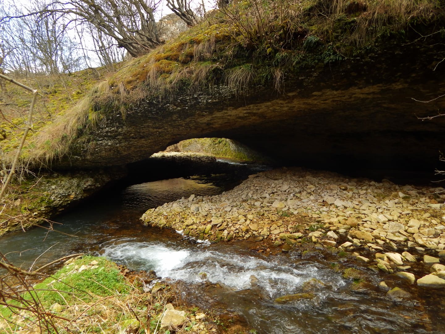 A natural rock bridge over the Rachene river in the canyon between Kameno Pole and Reselets